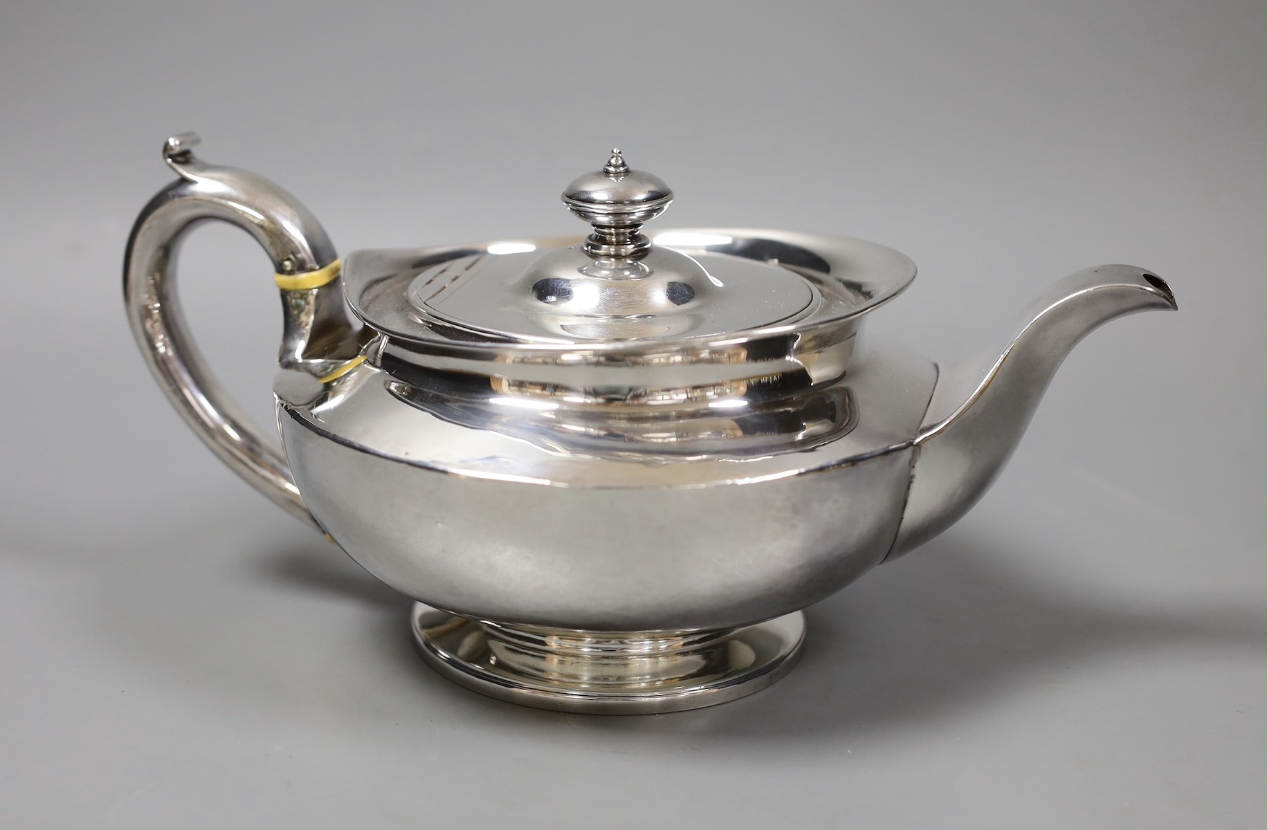 A George III squat circular silver teapot, by William Burwash, London 1820, gross 22oz.